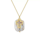 Cross Baroque Pearl Necklace by Starlight Jewelry