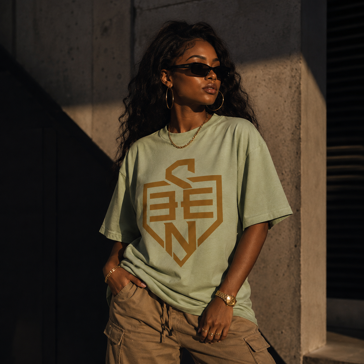 SEEN Shield Logo Tee — Gold Emblem Graphic T-Shirt
