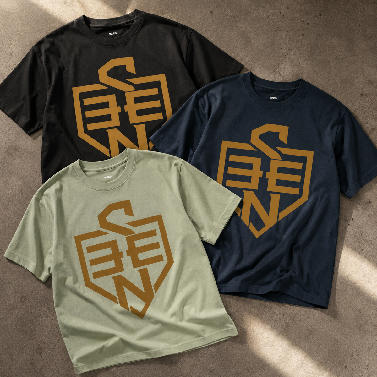 SEEN Shield Logo Tee — Gold Emblem Graphic T-Shirt