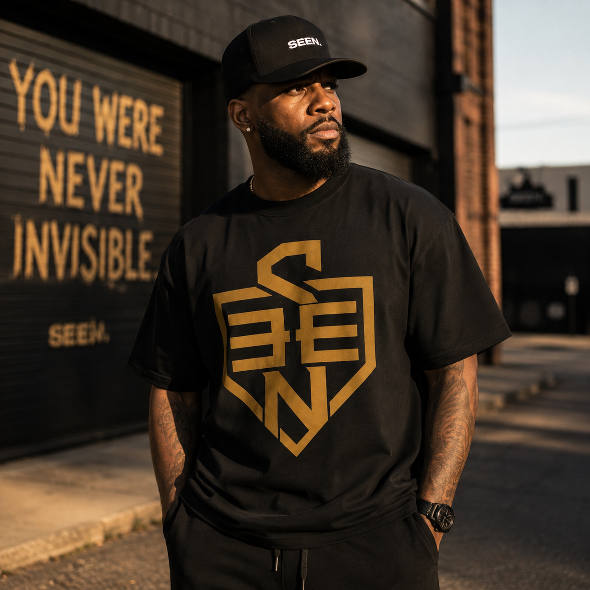 SEEN Shield Logo Tee — Gold Emblem Graphic T-Shirt